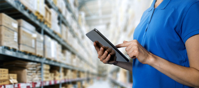 year-end inventory, woman, blue polo shirt, tablet, warehouse