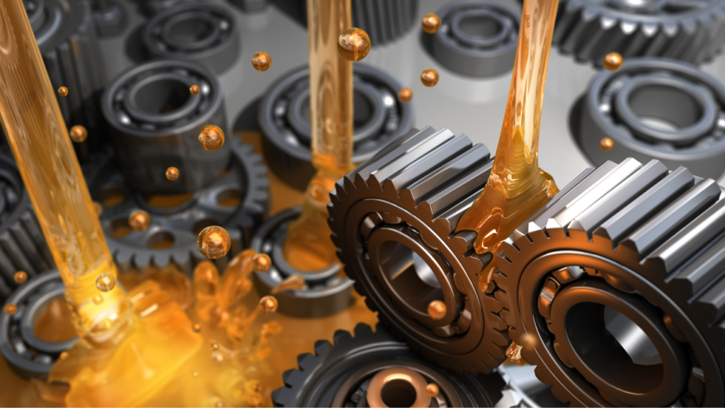 image of lubricant mixing, oil being poured between gears