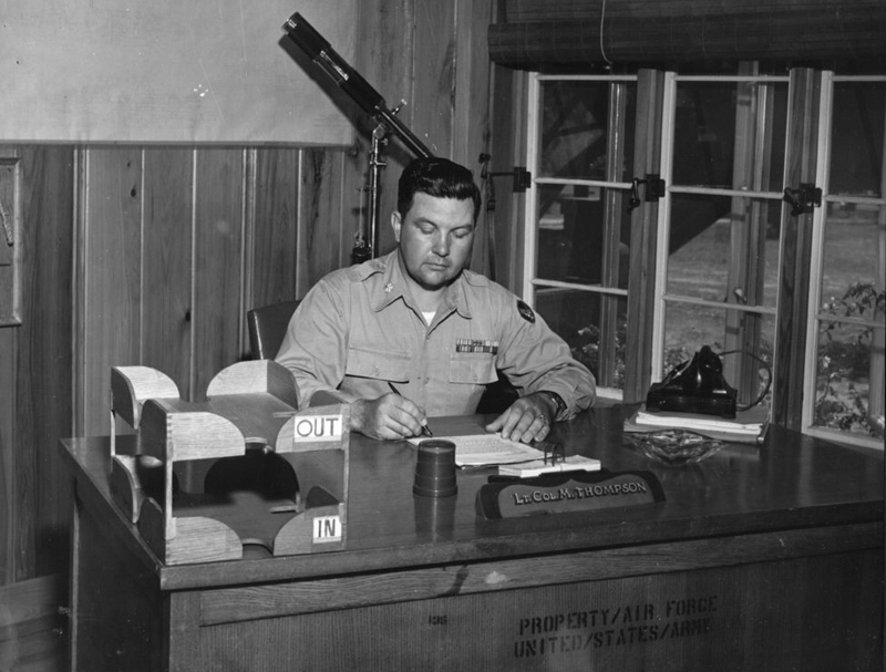 colonel thompson, young man in army uniform sitting at desk