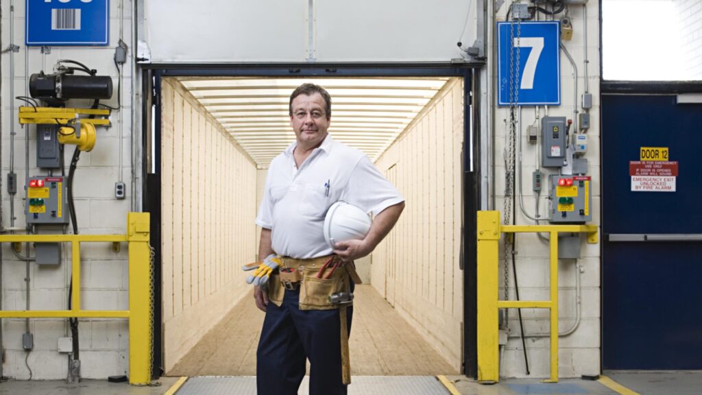 industrial worker holding hardhat