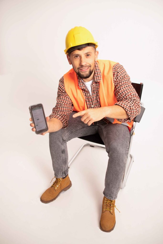 maintenance person with phone